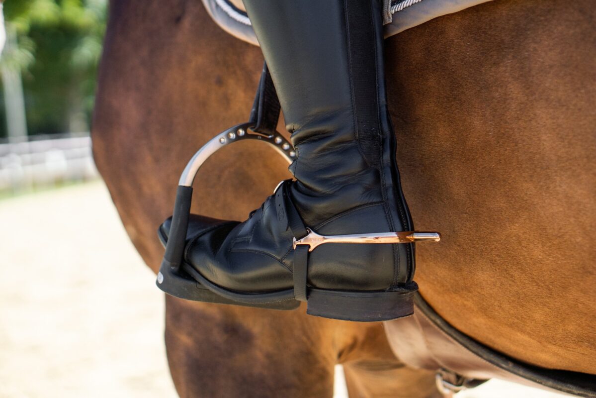 Barrel racing tack including spurs, breast collar, and saddle setup
